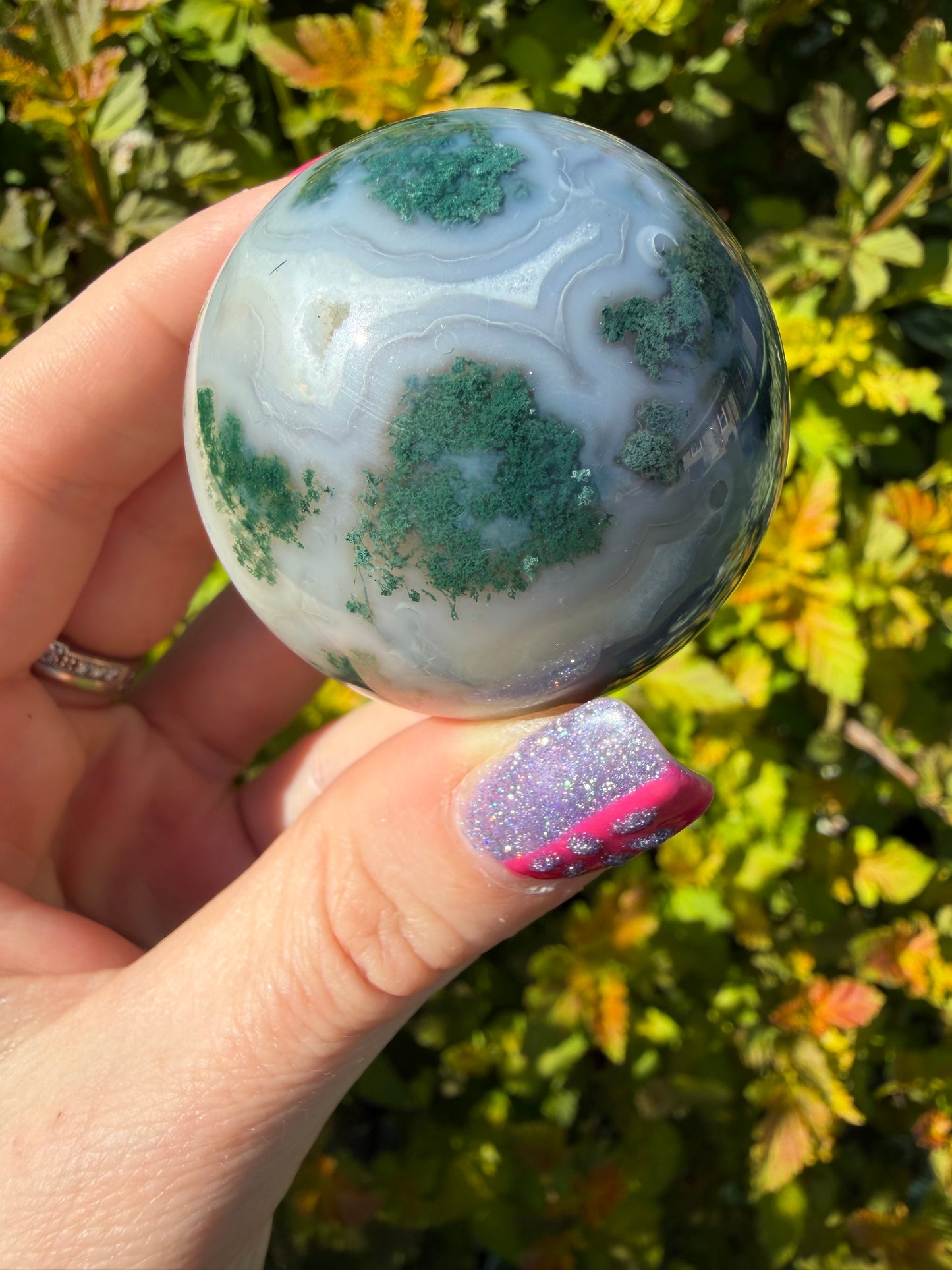 Moss Agate sphere on Butterfly Stand